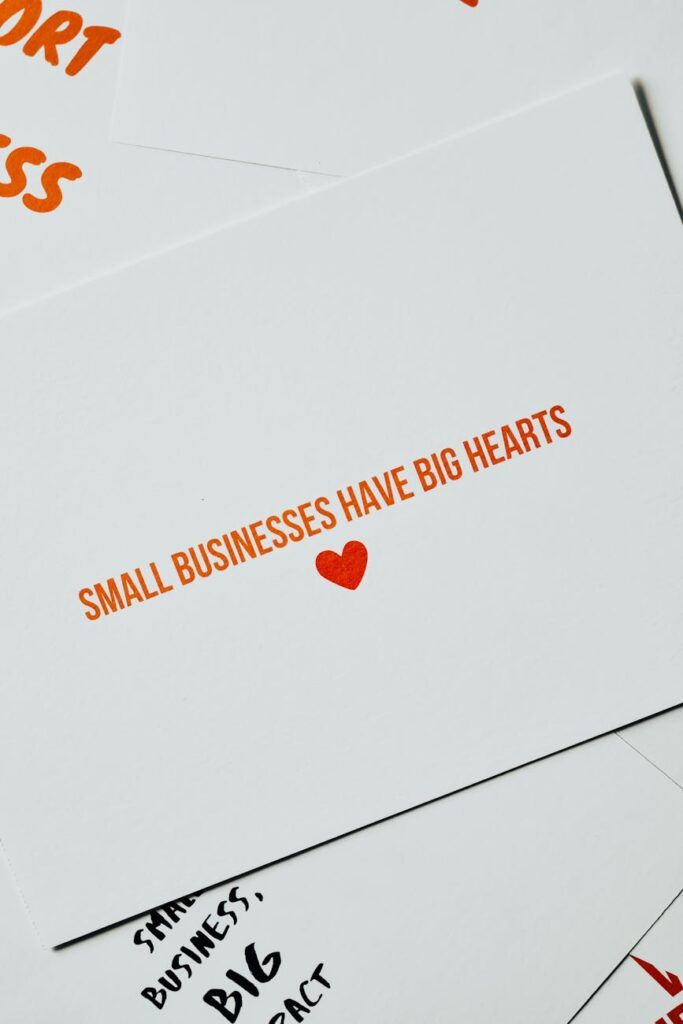 pexels-photo-7661285-7661285-1 Card with 'Small Businesses Have Big Hearts' message in orange lettering on white background.